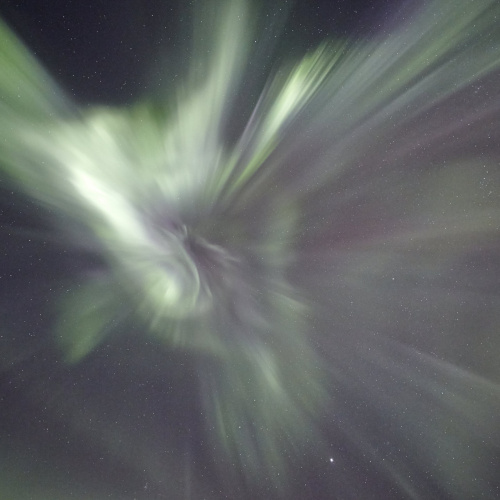 Corona streaking down from overhead in Lofoten